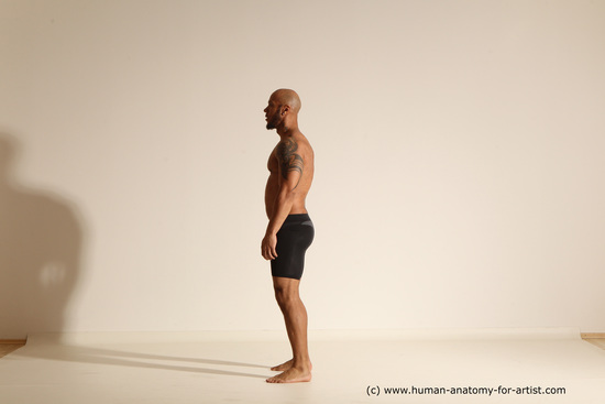 Underwear Gymnastic poses Man Black Muscular Bald Dancing Dynamic poses Academic