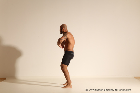 Underwear Gymnastic poses Man Black Muscular Bald Dancing Dynamic poses Academic