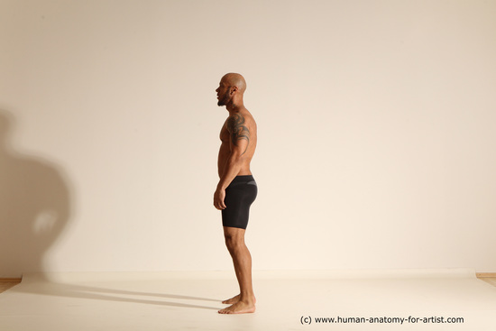 Underwear Gymnastic poses Man Black Muscular Bald Dancing Dynamic poses Academic