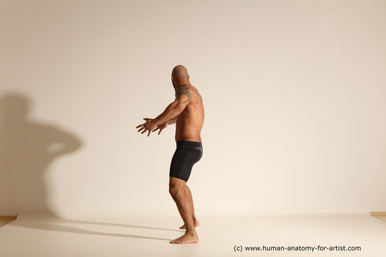 Underwear Gymnastic poses Man Black Muscular Bald Dancing Dynamic poses Academic