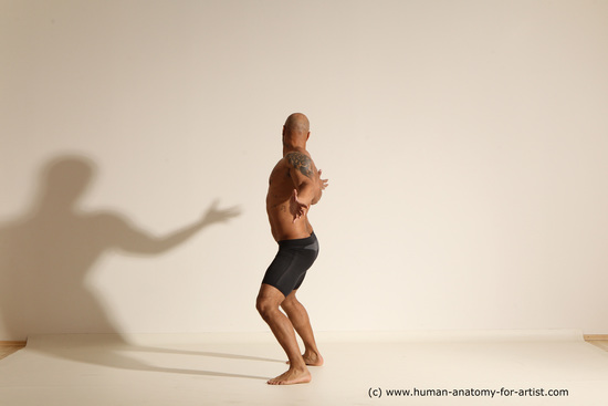 Underwear Gymnastic poses Man Black Muscular Bald Dancing Dynamic poses Academic