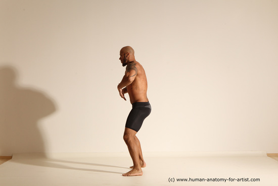 Underwear Gymnastic poses Man Black Muscular Bald Dancing Dynamic poses Academic