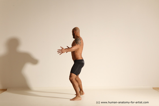 Underwear Gymnastic poses Man Black Muscular Bald Dancing Dynamic poses Academic