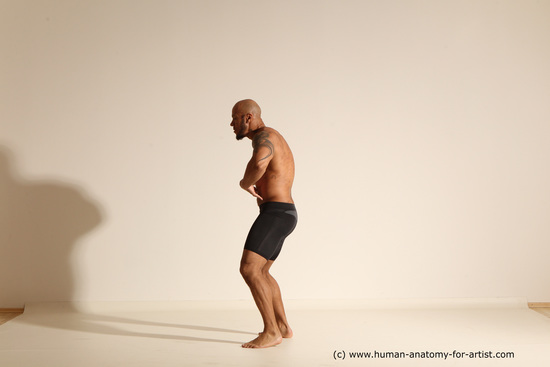 Underwear Gymnastic poses Man Black Muscular Bald Dancing Dynamic poses Academic