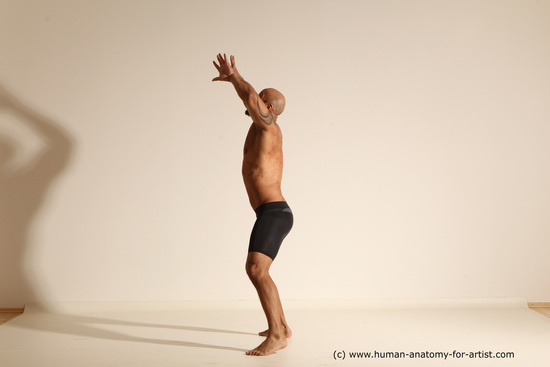 Underwear Gymnastic poses Man Black Muscular Bald Dancing Dynamic poses Academic