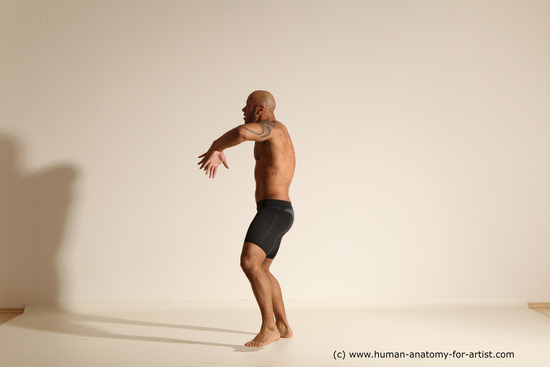 Underwear Gymnastic poses Man Black Muscular Bald Dancing Dynamic poses Academic