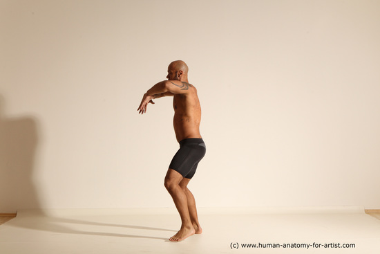 Underwear Gymnastic poses Man Black Muscular Bald Dancing Dynamic poses Academic