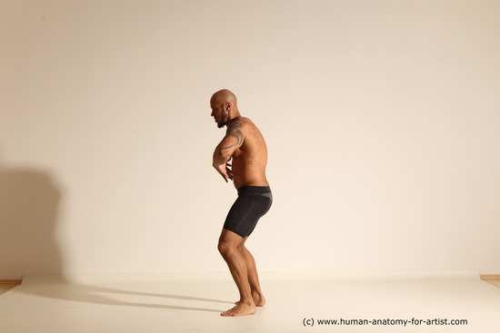 Underwear Gymnastic poses Man Black Muscular Bald Dancing Dynamic poses Academic