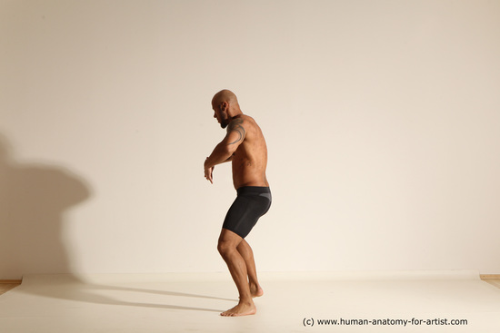 Underwear Gymnastic poses Man Black Muscular Bald Dancing Dynamic poses Academic