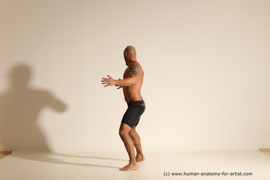 Underwear Gymnastic poses Man Black Muscular Bald Dancing Dynamic poses Academic