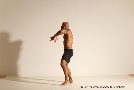 Underwear Gymnastic poses Man Black Muscular Bald Dancing Dynamic poses Academic