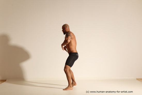 Underwear Gymnastic poses Man Black Muscular Bald Dancing Dynamic poses Academic