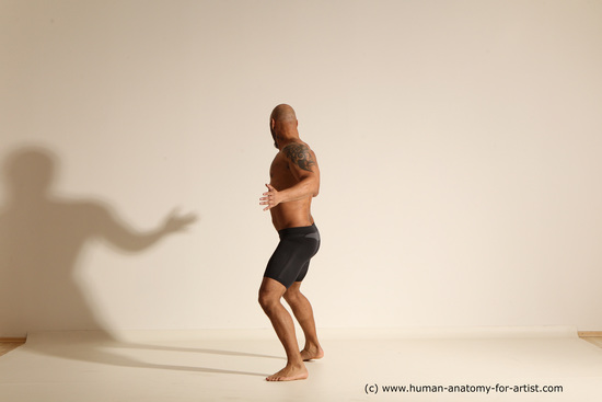 Underwear Gymnastic poses Man Black Muscular Bald Dancing Dynamic poses Academic