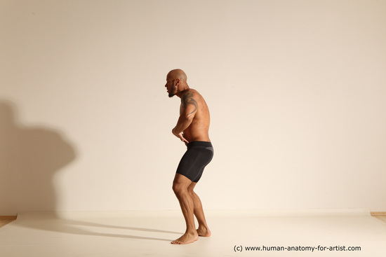 Underwear Gymnastic poses Man Black Muscular Bald Dancing Dynamic poses Academic