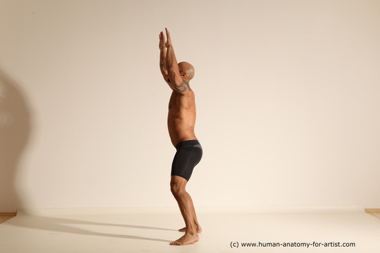 Underwear Gymnastic poses Man Black Muscular Bald Dancing Dynamic poses Academic