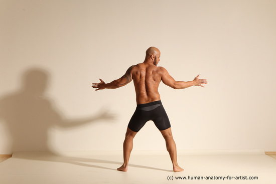 Underwear Gymnastic poses Man Black Muscular Bald Dancing Dynamic poses Academic