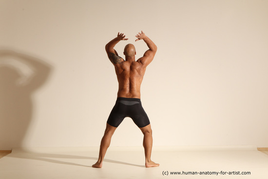 Underwear Gymnastic poses Man Black Muscular Bald Dancing Dynamic poses Academic