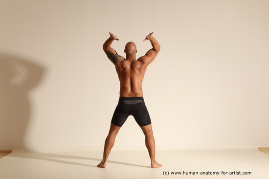 Underwear Gymnastic poses Man Black Muscular Bald Dancing Dynamic poses Academic