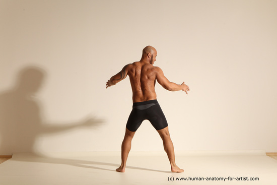 Underwear Gymnastic poses Man Black Muscular Bald Dancing Dynamic poses Academic