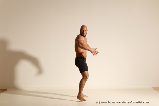 Underwear Gymnastic poses Man Black Muscular Bald Dancing Dynamic poses Academic