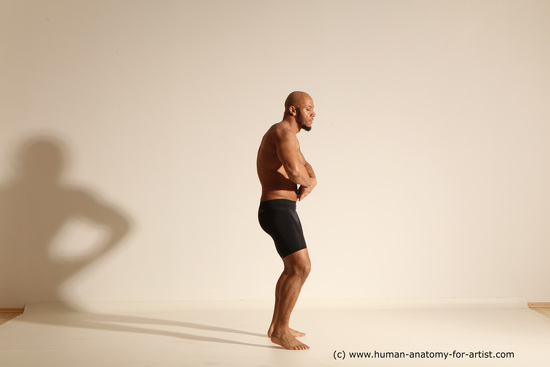 Underwear Gymnastic poses Man Black Muscular Bald Dancing Dynamic poses Academic