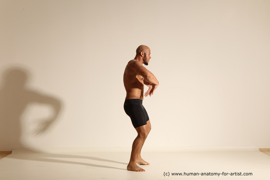 Underwear Gymnastic poses Man Black Muscular Bald Dancing Dynamic poses Academic