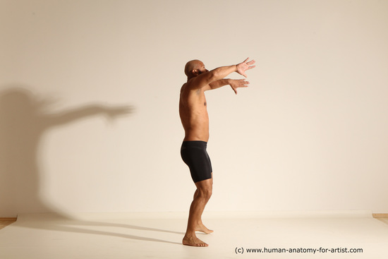 Underwear Gymnastic poses Man Black Muscular Bald Dancing Dynamic poses Academic