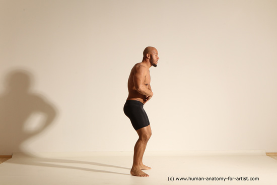 Underwear Gymnastic poses Man Black Muscular Bald Dancing Dynamic poses Academic