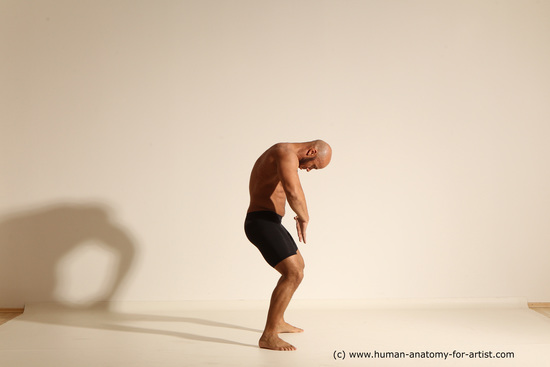 Underwear Gymnastic poses Man Black Muscular Bald Dancing Dynamic poses Academic