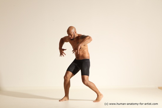 Underwear Gymnastic poses Man Black Muscular Bald Dancing Dynamic poses Academic