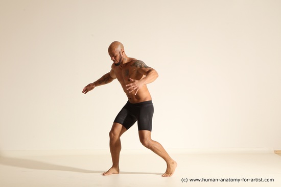 Underwear Gymnastic poses Man Black Muscular Bald Dancing Dynamic poses Academic