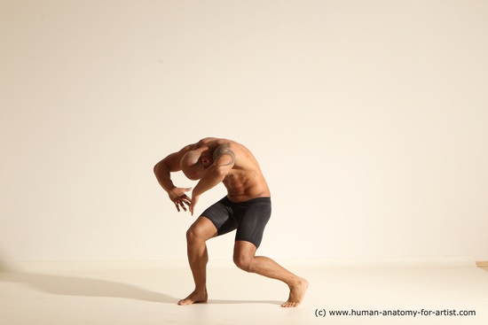 Underwear Gymnastic poses Man Black Muscular Bald Dancing Dynamic poses Academic