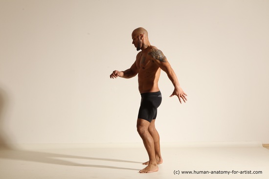 Underwear Gymnastic poses Man Black Muscular Bald Dancing Dynamic poses Academic