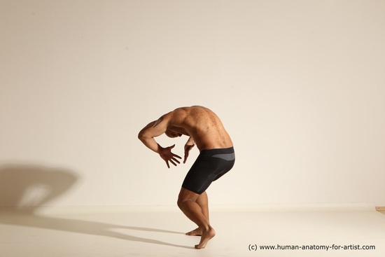 Underwear Gymnastic poses Man Black Muscular Bald Dancing Dynamic poses Academic