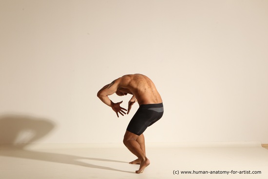 Underwear Gymnastic poses Man Black Muscular Bald Dancing Dynamic poses Academic