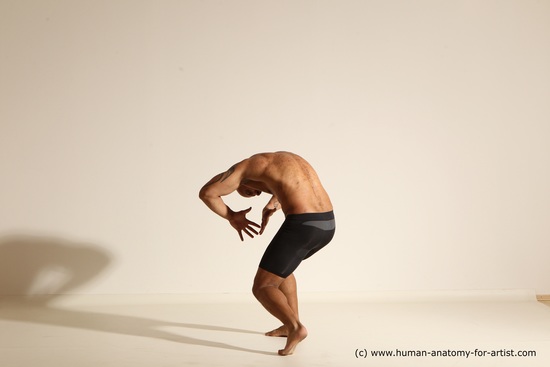 Underwear Gymnastic poses Man Black Muscular Bald Dancing Dynamic poses Academic