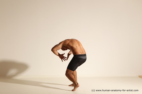 Underwear Gymnastic poses Man Black Muscular Bald Dancing Dynamic poses Academic