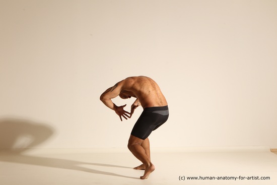 Underwear Gymnastic poses Man Black Muscular Bald Dancing Dynamic poses Academic