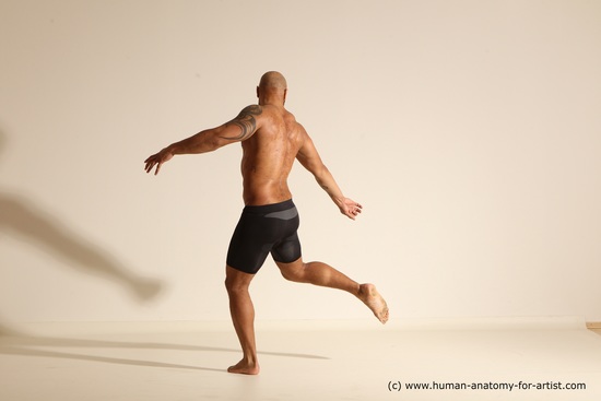 Underwear Gymnastic poses Man Black Muscular Bald Dancing Dynamic poses Academic