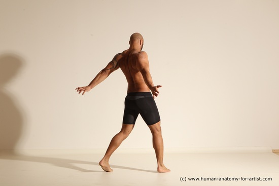 Underwear Gymnastic poses Man Black Muscular Bald Dancing Dynamic poses Academic