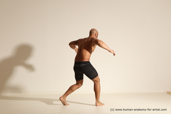 Underwear Gymnastic poses Man Black Muscular Bald Dancing Dynamic poses Academic