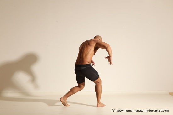 Underwear Gymnastic poses Man Black Muscular Bald Dancing Dynamic poses Academic