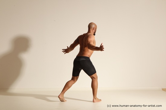 Underwear Gymnastic poses Man Black Muscular Bald Dancing Dynamic poses Academic