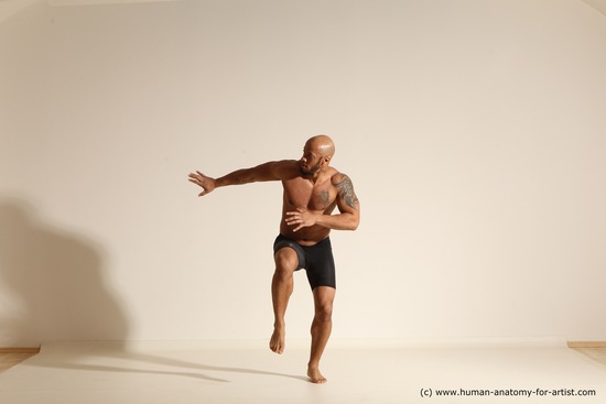 Underwear Gymnastic poses Man Black Muscular Bald Dancing Dynamic poses Academic