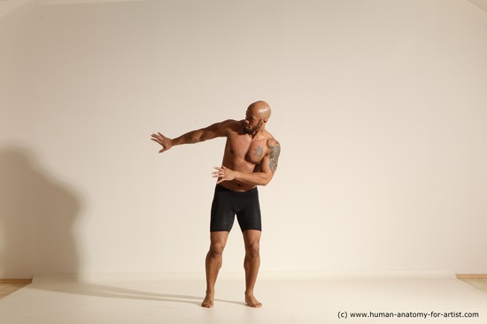 Underwear Gymnastic poses Man Black Muscular Bald Dancing Dynamic poses Academic