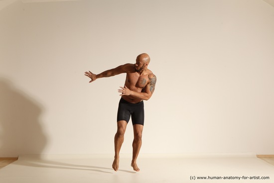 Underwear Gymnastic poses Man Black Muscular Bald Dancing Dynamic poses Academic