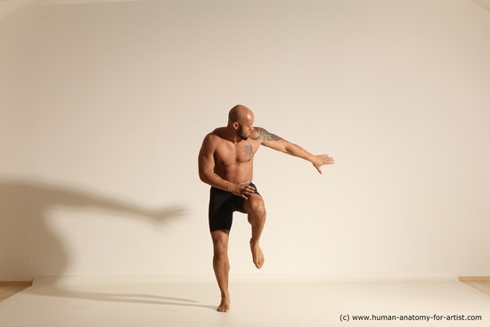 Underwear Gymnastic poses Man Black Muscular Bald Dancing Dynamic poses Academic