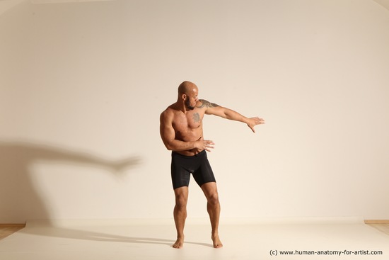 Underwear Gymnastic poses Man Black Muscular Bald Dancing Dynamic poses Academic