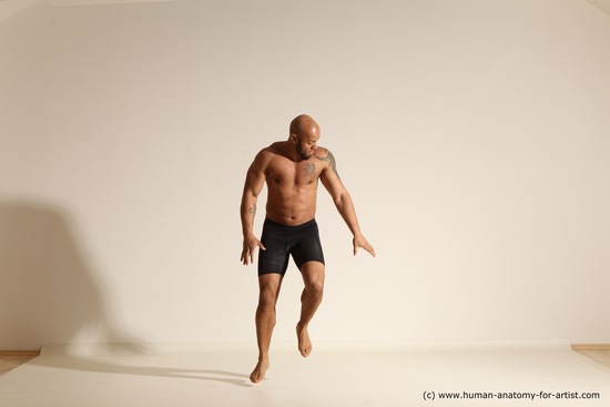 Underwear Gymnastic poses Man Black Muscular Bald Dancing Dynamic poses Academic