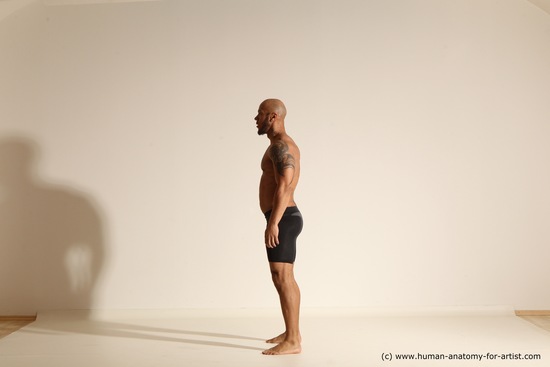 Underwear Gymnastic poses Man Black Muscular Bald Dancing Dynamic poses Academic